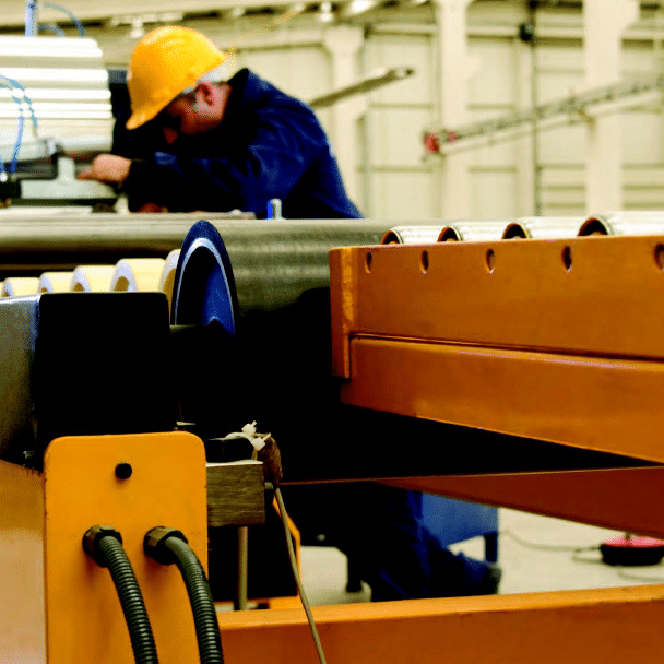 Man in hardhat working on machine