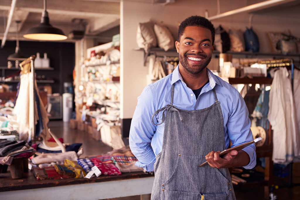 Portrait Of Male Owner Of Gift Store With Digital Tablet