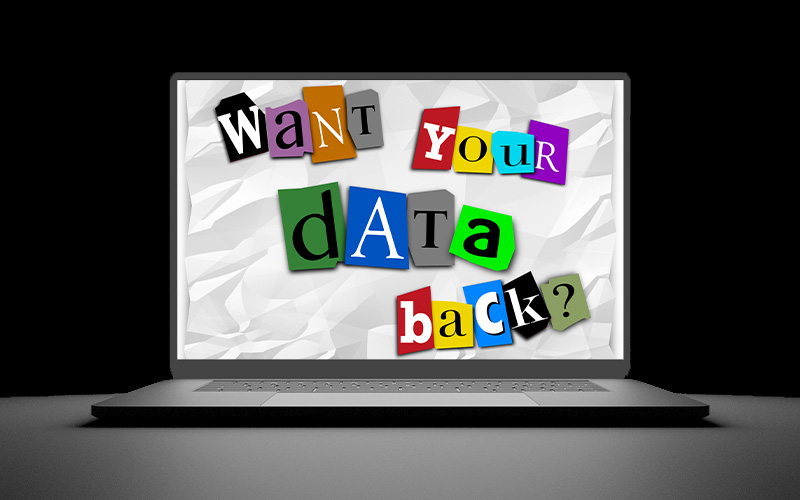 Laptop open with ransom note reading want your data back?