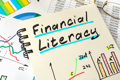 Financial Literacy written on a notepad