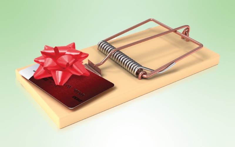 gift card with bow on top of mouse trap