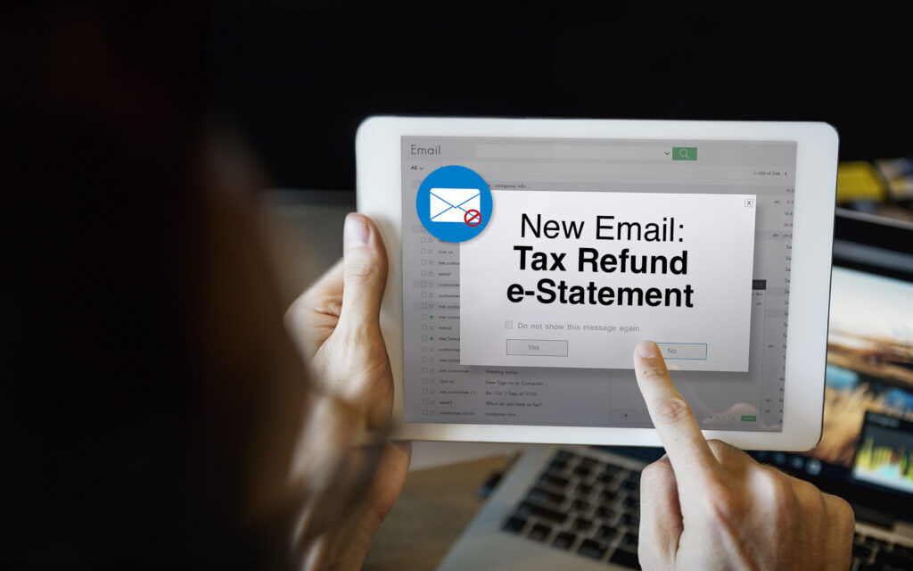 Tablet with pop up reading "New Email: Tax Refund e-Statment"