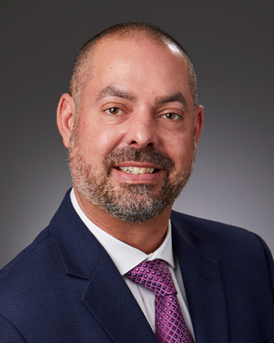headshot of Miles White
